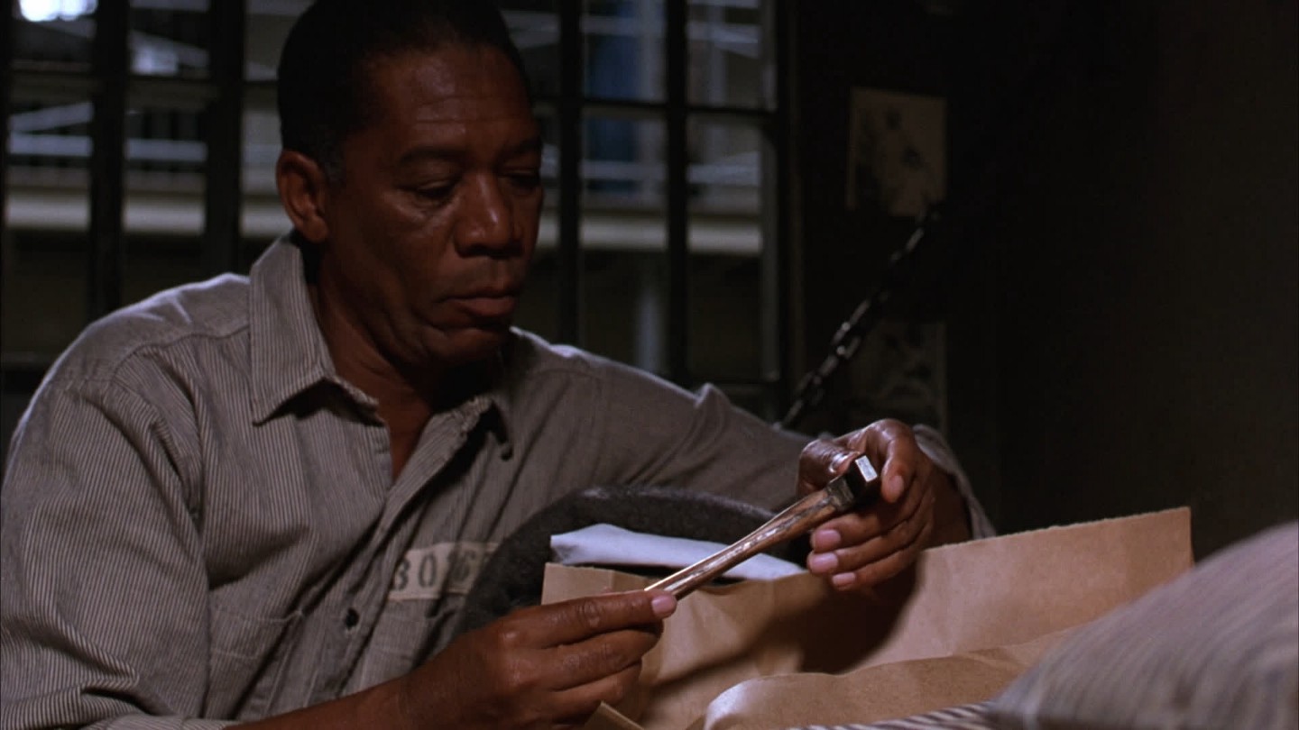 Ellis Boyd Redding holding a rock hammer.